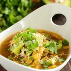 a close up of a bowl of soup on a table