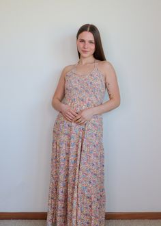 You'll love this Kira 70's maxi dress from Nation LTD all summer. The flower print maxi dress features a smocked bodice and halter neckline. It's fitted through the bodice and has a loose skirt. Pair with your favorite pair of sandals all summer long. Details: 100% Pima Cotton Machine Washable True to size Model is 5'4" and wearing a size small. Loose Skirt, Nation Ltd, 70s Maxi Dress, Dress Home, Halter Neckline, Printed Maxi, Printed Maxi Dress, Small Tops, Pima Cotton