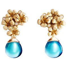 The Plum Flowers contemporary jewelry collection was featured in Vogue UA review and designed by oil painter from Berlin, Polya Medvedeva. These clip-on earrings are made of 18 karat yellow gold and encrusted with 6 round diamonds and cabochon blue quartzes. The drops can be taken on or off. The pair can be ordered with other gems at the same price. That makes the earrings a many-in-one, as you can replace the cabochon drops with some other gems or wear the earrings in an everyday version withou Sculptural Flowers, Vogue Art, Topaz Yellow, Art Nouveau Earring, Cocktail Earrings, Contemporary Earrings, Jewellery Inspiration, Plum Blossom, Hanging Earrings