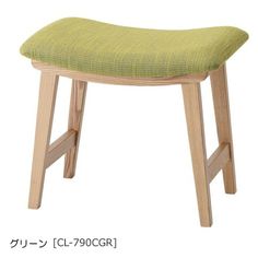 a small wooden stool with a green seat cover on it's backrest and legs