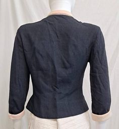 Circa 1950s Heathered navy blue suit jacket with angora trim No label Small shoulder pads Rhinestone and plastic buttons down front Peter Pan collar and angora/angora blend collar and cuffs. Feels like wool This jacket is just so charming and demure! This fits a petite size best. Check the measurements carefully. Bust 34 Waist 26 Length from shoulder to hem 17 inch Shoulder to shoulder 14 inch Sleeve length 18 inch..looks like 3/4 inch sleeve. Good condition. Jacket fabric I see no flaws, al but Blue Suit Jacket, Penny Lane Coat, Jacket Fabric, Navy Blue Suit, Wool Poncho, Lace Jacket, Floral Jacket, Wool Suit, Short Coat