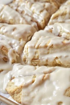 a pan filled with glazed donuts covered in icing