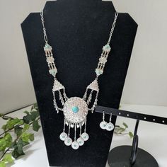 Pretty Set Silver Tone Southwestern Style Necklace With Turquoise Crackle Stone Accents Adjustable Chain Measures 23" Total Length Matching Hook Style Earrings New #31 Trendy Fall Fashion Casual Dressy Work Boho Bohemian Hippie Gypsy Silver Turquoise Dangle Necklace In Sterling Silver, Silver Dangle Turquoise Necklace In Sterling Silver, Southwestern Sterling Silver Jewelry For Festivals, Turquoise Dangle Necklace In Sterling Silver, Nickel Free Southwestern Dangle Jewelry, Southwestern Silver Turquoise Necklace For Festival, Handmade Silver Turquoise Dangle Necklace, Bohemian Sterling Silver Jewelry Set In Silver, Blue Sterling Silver Jewelry For Festival