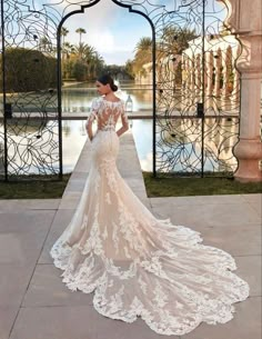 a woman in a wedding dress standing outside