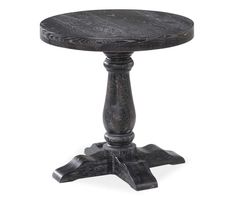 an old fashioned wooden table with black wood legs and a round top, on a white background