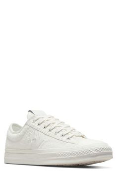 A 1970s icon gets a modern refresh in a monochrome oxford sneaker that's topped with plush terrycloth and layered on the sides with leather logo appliqués. Lace-up style Removable OrthoLite® insole Textile upper and lining/rubber sole Imported Vintage Sneakers With Laces And White Sole, Vintage White Lace-up Sneakers, Vintage White Leather High-top Sneakers, Vintage Lace-up Sneakers With Stitched Sole, Vintage White Embroidered Sneakers, Converse Star Player 76, Converse Star Player, Converse Star, Oxford Sneakers