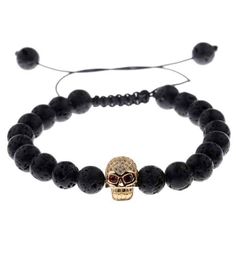 do you love to have a discreet style but a unique touch? this dark golden skull bracelet is really perfect for you! you should have it in your jewelry collection! Welcome ladies and gentlemen, if you're looking for a brand new Jewel that you can wear everyday and boost your style to its limits then you might want to pick this mens skull bead bracelet up for yourself, it has a very unique design that is stealthy and classy at the same time with a great color configuration of black red and gold, t Diamond Skull, Lava Stone Bracelet, Volcanic Stone, Pave Beads, Lucky Bracelet, Woven Bracelet, Ladies And Gentlemen, Beaded Rope, Skull Bracelet