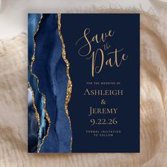 save the date card with blue and gold foil