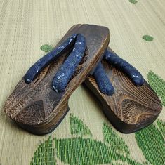 Mens wooden geta sandals. Super light weight kiln dried kiri wood with rubber soles. Brown wood with cotton thongs.28cm (11") x 10.3cm (4") x 4cm (1.5") heel height. Geta sandals are traditionally worn with heels sticking out a bit. Geta sandals are wooden sandals. Geta looks like a hybrid of flip-flops and clogs. Cloth v-shaped thong called 'hanao' is knotted at the bottom in a special way. Geta sandals are traditionally worn with summer cotton kimono called yukata or jinbei.Traditional style h Geta Sandals, Wooden Sandals, Cotton Kimono, Stick It Out, Dragonflies, Summer Cotton, Navy Stripes, Brown Wood, V Shape