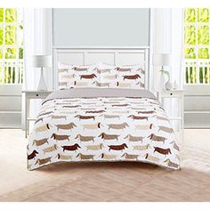 a bed with a white headboard and brown dachshund bedspread