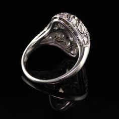 Beautiful Antique Art Deco Platinum Fancy Colored Diamond Filigree Two Stone Ring. This unbelievable band has two fancy colored diamonds in a pristine art deco mounting. Item #R0801 Metal: Platinum Diamonds: 1.17 ct Old Cut Fancy Grey and a 1.27 ct Old Cut Fancy Brownish Yellow. Clarity: VS2 - SI1 Accent Diamonds: Approximately .50 cts Color: H Clarity: VS2 Weight: 5.2 Grams Ring Size: 5 1/2 This ring can be sized for an additional $50 Measurements: 17.9 mm width Measurement of the ring off the Art Deco White Gold Diamond Ring In Platinum, Art Deco Style Diamond Filigree Ring For Formal Occasions, Art Deco Diamond Ring With Diamond Accents For Wedding, Art Deco Diamond Filigree Ring For Formal Occasions, Formal Art Deco Filigree Ring With Diamond Accents, Formal Art Deco Diamond Ring In Diamond White, Art Deco Diamond Ring With Accents For Formal Events, Art Deco Diamond Rings With Intricate Design, Art Deco White Gold Diamond Ring