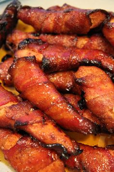 some bacon sticks are on a plate and ready to be eaten