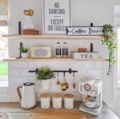 the kitchen counter is clean and ready to be used as a coffee bar or breakfast bar