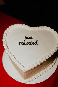 two heart shaped cakes with the words just married written on them