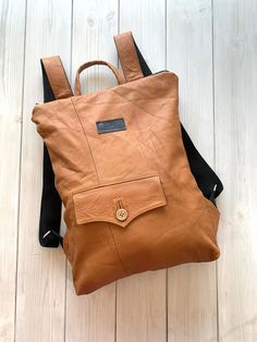 "Minimalist Brown Leather Backpack, Upcycled Brown Backpack, Brown Rucksack Upcycled leather backpack is made from finest leather jacket. Zip it and you will find natural lining with open and zipped pocket inside. LeaF leather backpacks are very light and not overloads your back. If you need to carry only a few things, this convertible backpack purse could be used as clutch - just roll it or fold it. Minimalist design leather backpack fits 15\" laptop.  |WIDTH: 32 cm (12.5 in).  |HEIGTH: 42 cm ( Everyday Backpack With Leather Lining And Vegetable Tanned Leather, Everyday Leather Standard Backpack, Vegetable Tanned Leather Backpack With Leather Lining, Vegetable Tanned Leather Backpack With Leather Backing, Functional Leather Backpack With Leather Handles, Leather Backpack With Waxed Finish, Leather Backpack With Waxed Finish For On-the-go, Daily Backpack With Leather Backing In Vegetable Tanned Leather, Everyday Backpack In Vegetable Tanned Leather