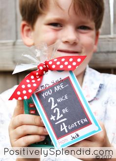 a young boy holding up a sign that says you are 2 nice be 4 rotten