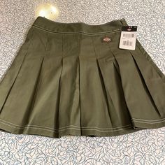 Great Dickies Pleated Skirt. Nice Shade Of Military Green With Contrast White Stitching. Hidden Side Zipper Closure. This Is New With Tag And Is Size 25. Green Pleated School Skirt, Green Pleated Skirt For School, Chromakopia Outfit, Pleated Skirt Aesthetic, Dickies Skirt, Black Plaid Skirt, Green Pleated Skirt, Skirt Aesthetic, Pleated Skirt Short