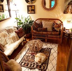 a living room filled with lots of furniture and decor on top of a wooden floor