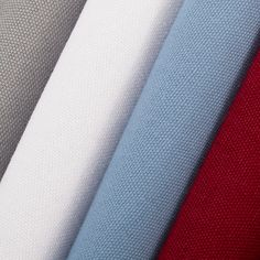 several different colors of fabric are shown in this close up shot, including red, white and blue