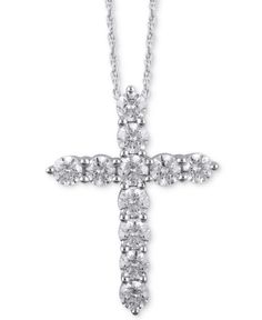 Express your faith with beauty and grace with this diamond cross pendant necklace set in 14k white gold. White Diamond Accented Crucifix Jewelry, Diamond White Crucifix Cross Necklace For Anniversary, Diamond White Crucifix Necklace For Anniversary, White Diamond Crucifix Necklace, Elegant Brilliant Cut Cross Necklace For Anniversary, White Crucifix Cross Necklace With Brilliant Cut, White Crucifix With Diamond Accents Jewelry, White Crucifix With Diamond Accents, White Crucifix Fine Jewelry