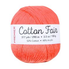 red ball of cotton yarn with the words cotton fair in white on top and bottom