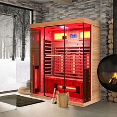 a red hot tub sitting next to a fireplace