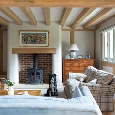 a living room filled with furniture and a fire place