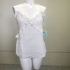 Approx Measurements: Bust Across: 20" Length: 19" Details: V-Neck, Adjustable Straps, Ruffle Trim, Metallic Threading Material: Cotton, Metallic Lining Condition: Nwt M- 0249 Feminine V-neck Camisole With Ruffles, White V-neck Top With Ruffles, Fitted V-neck Camisole With Ruffles, V-neck Ruffled Camisole For Vacation, Chic V-neck Ruffled Camisole, White V-neck Camisole For Vacation, Beach Cotton Tops With Ruffled Straps, Cotton Tops With Ruffled Straps For Beach, Summer Tank Top With Lace Trim And Ruffled Straps