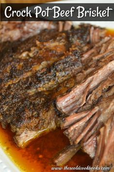 crock pot beef brisket on a plate with gravy