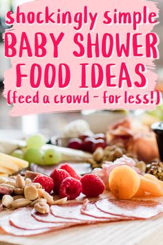 a wooden table topped with fruit and nuts next to a sign that says shockingly simple baby shower food ideas