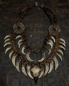 Crafted for the daring and unique, this neck jewelry embodies a fusion of Bohemian style and post-apocalyptic vibes. Perfect for shaman costumes, LARP products, and festival decorations, it features fangs and bird skulls for an edgy touch. This double necklace adorned with a ring necklace is a must-have for horror lovers looking to make a bold statement with their accessories. A distinctive piece that sets you apart from the crowd. ❗️DETALIS❗️ Our products are meticulously crafted by skilled art Unique Handmade Jewelry For Alternative Fashion, Viking Style Handmade Festival Jewelry, Handmade Gothic Horned Jewelry, Handmade Bohemian Jewelry For Alternative Fashion, Bohemian Skull-shaped Metal Jewelry, Shaman Costume, Demon Costume, Neck Jewelry, Horror Lovers