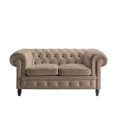 an image of a couch with buttons on the back and armrests in beige