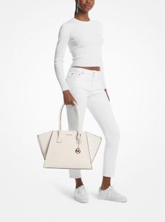 Equally versatile and sophisticated, our Avril tote is a must-have addition to your handbag lineup. Crafted from leather and suede, this gusseted design is rendered in a standout silhouette that’s generously sized to store a day’s worth of essentials. It’s the perfect complement to office-ready looks and casual weekend wear alike. Suede Tote Bag, Large Leather Tote Bag, Suede Tote, Satchel Tote Bag, Large Leather Tote, Casual Weekend, Tote Bag Leather, Weekend Wear, Daily Essentials