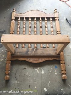 an old wooden chair sitting on top of a floor