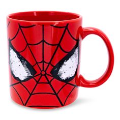 a red spider - man mug with eyes painted on the front and sides, sitting in front of a white background