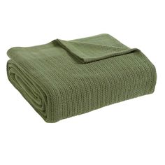 a green blanket folded on top of each other