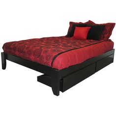 a bed with red sheets and pillows on it's headboard, in front of a white background