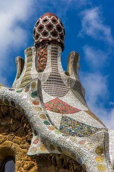 the top part of a building that is made out of mosaic tiles