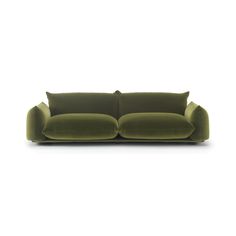 a green couch sitting on top of a white floor