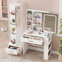 a white vanity with drawers and mirror in a room next to a potted plant