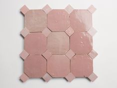 pink hexagonal tiles arranged on a white surface