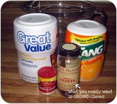 ingredients for making orange marmalade sitting on a table next to an empty jar