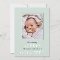 a birth announcement card with a baby's photo