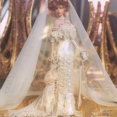 a barbie doll wearing a wedding gown and veil