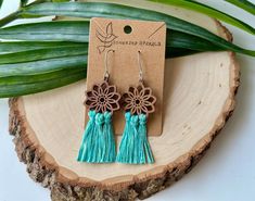 Get your free-spirit boho vibe on with these fun handmade macrame earrings!  These bohemian earrings were carefully hand knotted using soft recycled cotton cord on a wood piece. These dangle earrings are very lightweight. Makes the perfect gift for the hippie girl in your life.  Handmade with love in the USA.  *Nickel free earrings. Handmade with eco-friendly materials! I use high quality cord made from recycled cotton. Nearly all my products are made with recycled cotton or recycled polypropylene cord. I strive to be as eco-friendly as possible with all my materials and processes. ** Attention local buyers ** If you prefer to arrange for in-person pick up instead of having your item shipped to you, please message me after placing your order and I can refund any shipping costs where applic Turquoise Handmade Tassel Earrings For Festivals, Handmade Turquoise Tassel Earrings For Festival, Spring Bohemian Turquoise Jewelry, Bohemian Adjustable Macrame Tassel Earrings, Bohemian Dangle Tassel Earrings For Spring, Handmade Hippie Jewelry For Spring, Bohemian Turquoise Flower Earrings Nickel Free, Bohemian Macrame Tassel Dangle Earrings, Bohemian Macrame Tassel Earrings