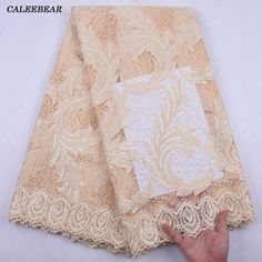 African Lace Fabric With Sequins French Lace Wedding-FrenzyAfricanFashion.com Elegant Wedding Fabric With Floral Embroidery, Embroidered Fitted Fabric For Wedding, Elegant Beige Embroidered Fabric For Wedding, Embroidered Beige Wedding Fabric, Embroidered Lace Fabric For Wedding, Festive Wedding Fabric With Lace Work, Embroidered Cream Fabric For Wedding, Fitted Beige Embroidered Fabric For Wedding, Elegant Gold Lace Fabric