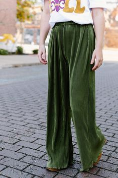 Look your absolute best with these olive green pleated pants. Crafted from a stretchy and ultra comfortable fabric with an elastic waistband, these pants offer a flattering, high waisted fit and elegant pleated design for a sophisticated, yet effortless look. Feel confident and beautiful in these flowy bottoms! Elastic waistband and high waisted Runs true to size with lots of stretch 100% Polyester model, Lauryn is wearing a size small Boutique Trends, Pleated Pants, Pet Hair, Feel Confident, Trend Setter, Hosiery, Olive Green, High Waisted, Elastic