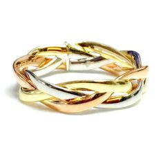 Classic and chic, this rolling ring intertwined braided trinity is crafted with 14k rose, yellow, and white gold bands. The three bands are weaved over one another in an elegant and comfortable fashion. Available in sizes 6 to 8, this gorgeous tricolor braded ring comes in a complimentary gift box.14K Tricolor yellow w Tri Color Gold Rings, Colored Wedding Bands, Braided Wedding Band, Gold Stacking Rings Wedding, Rolling Ring, Family Ring, Pet Memorial Necklace, Trinity Ring, Memorial Pendant