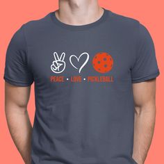 a man wearing a t - shirt that says peace love pickleball on it