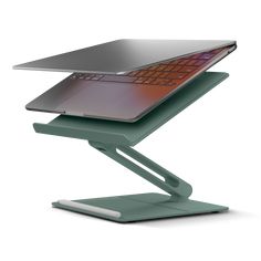 a laptop computer sitting on top of a green stand with an orange keyboard and mouse